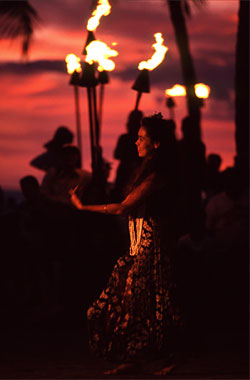 Beautiful Hula Dancer in the end of the Sunset at Waikiki Beach