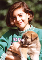 a girl with her puppy
