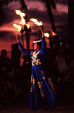 Beautiful Hula Dancer in the end of the Sunset at Waikiki Beach, presented by the Mayor's Office of the Culture and the Arts City and County of Honolulu