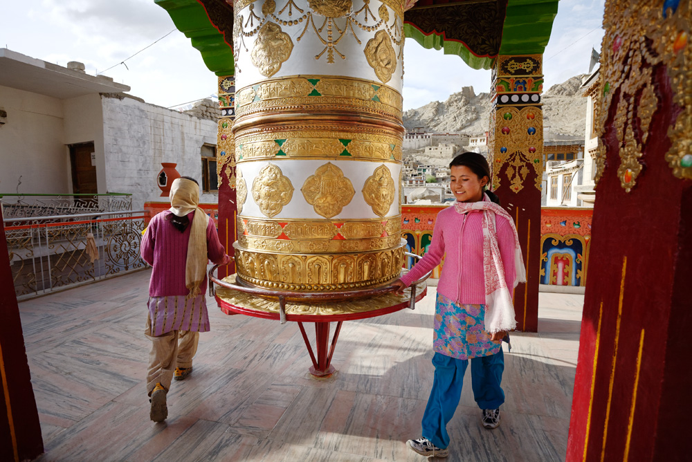 Children Turning Big Prayer Wheel