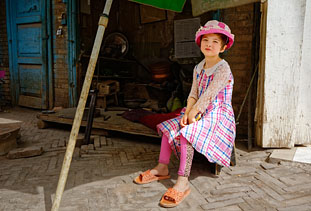 The pink hat suits you really well! Kashgar