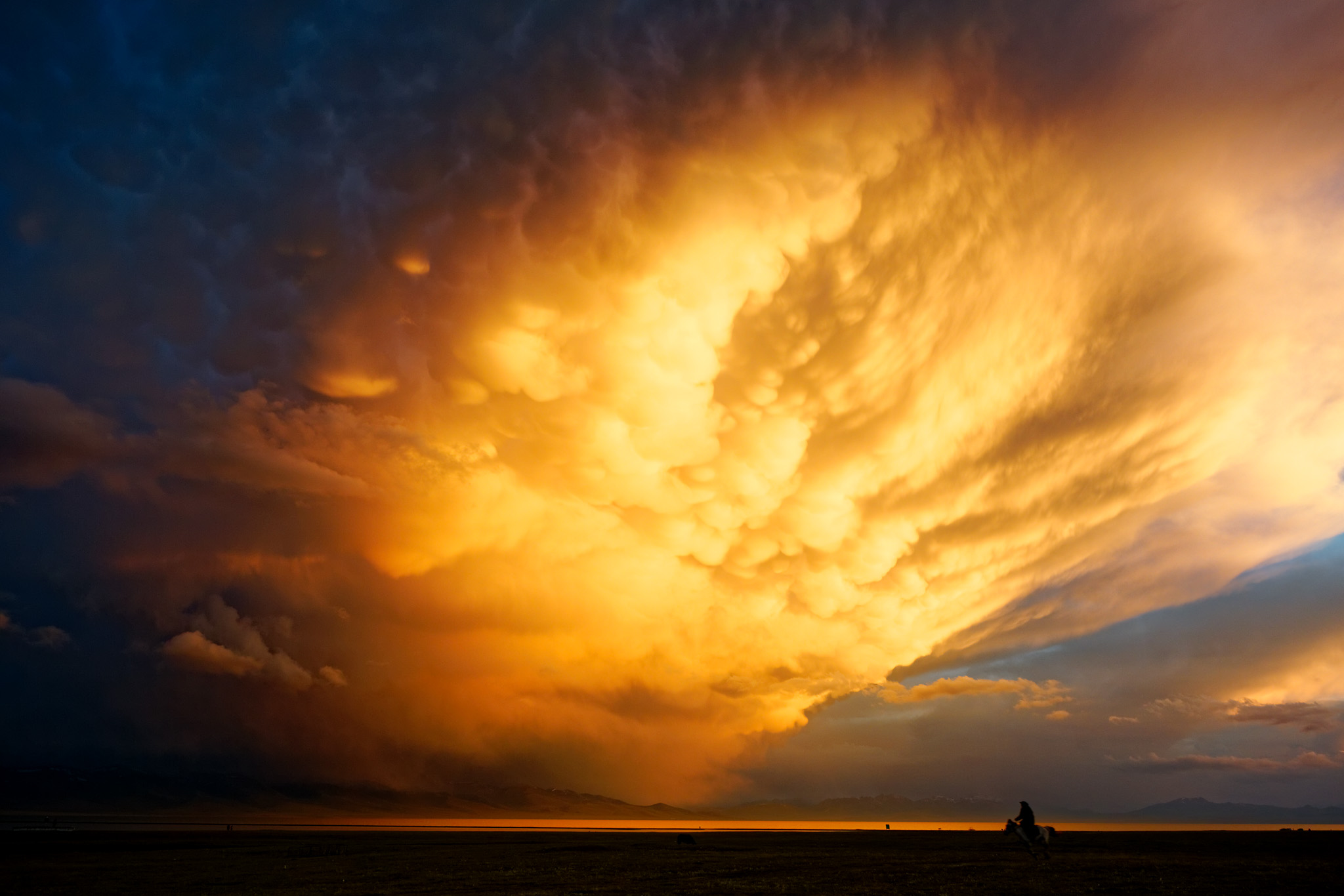 Song-Kul Lake shining in the setting sun